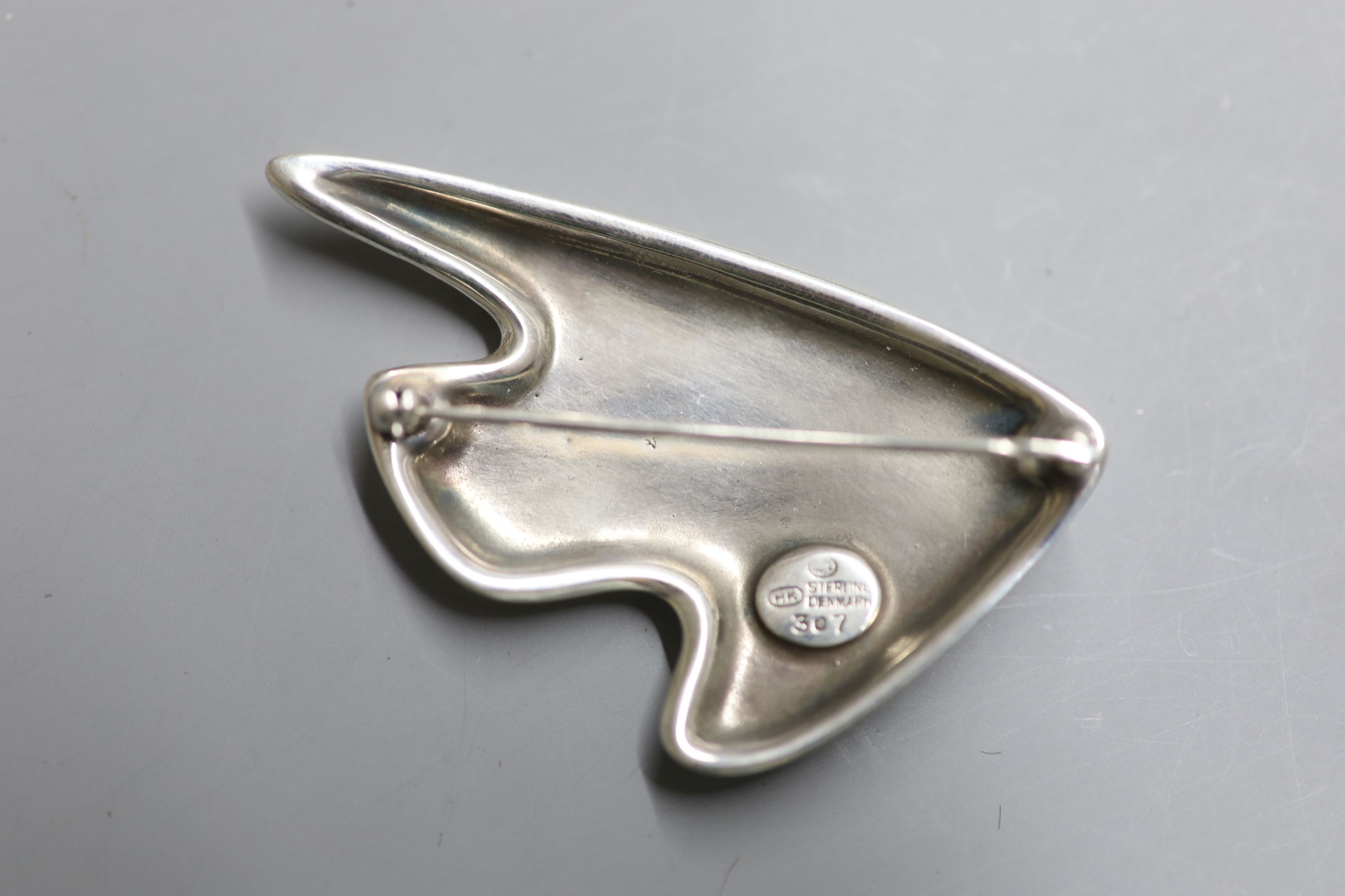 A Henning Koppel for Georg Jensen 925 and two colour blue enamel stylised fish brooch, design no. 307, 61mm, gross 30 grams.